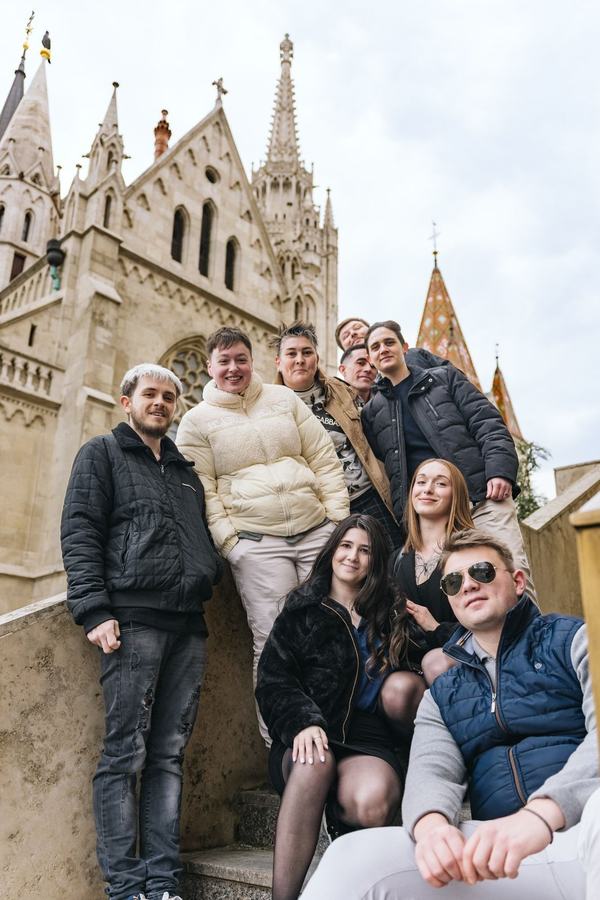 A group of friends on the stairs in front of Matthias Church